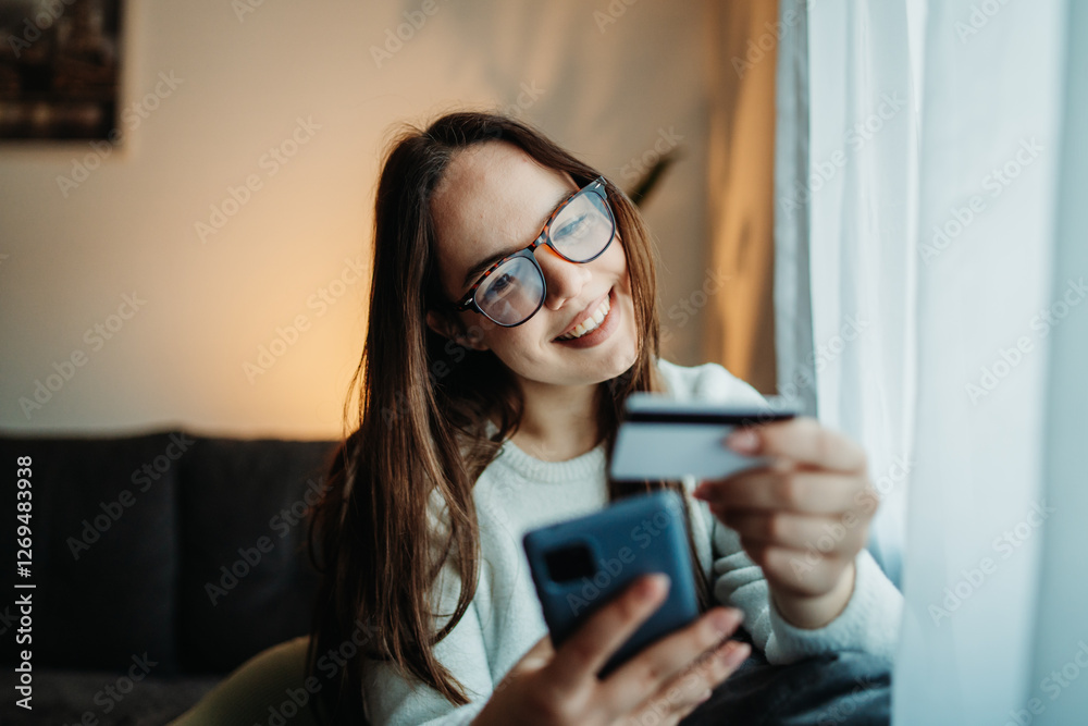 Young caucasian woman buy or pay online on smart phone using credit card
Young caucasian woman buy or pay online on smart phone using credit card
