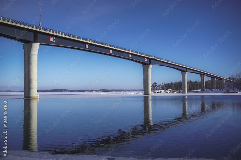 Vekaransalmi bridge and a beautiful winter day at the lakeside. Winter lake landscape Vekaransalmi bridge and a beautiful winter day at the lakeside. Winter lake landscape