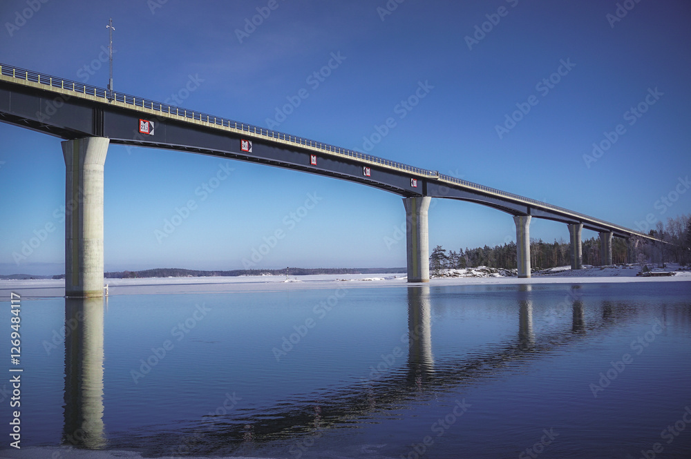Vekaransalmi bridge and a beautiful winter day at the lakeside. Winter lake landscape Vekaransalmi bridge and a beautiful winter day at the lakeside. Winter lake landscape