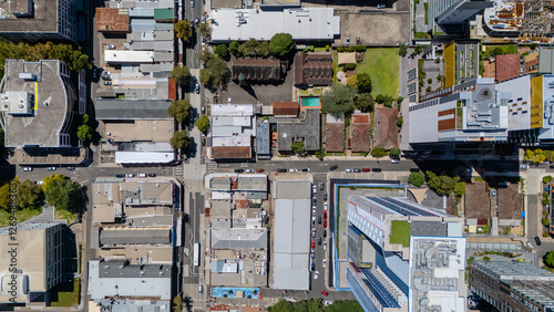 Drone view looking down on Commercial Suburb of Burwood in Sydney residential houses in suburbia suburban houses shops and streets park NSW Australia  photo