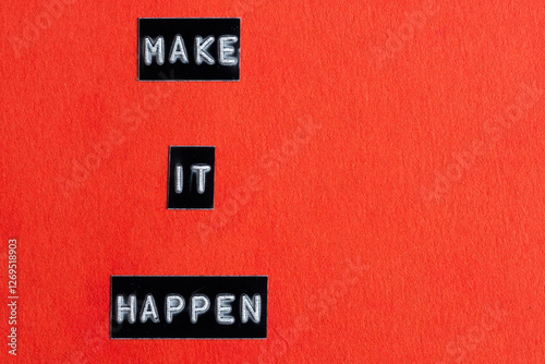 Make it happen words on red background. Motivational and inspirational quote.