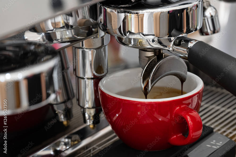 Professional espresso coffee machine while preparing espressos coffee red cup.Close-up of black coffee menu pouring from the coffee machine in cafe. Professional espresso coffee machine while preparing espressos coffee red cup.Close-up of black coffee menu pouring from the coffee machine in cafe.