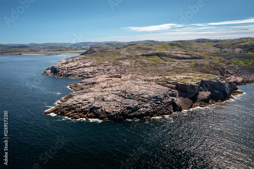 top view of the coast of the Barents Sea near the village of Teriberka on a clear summer day