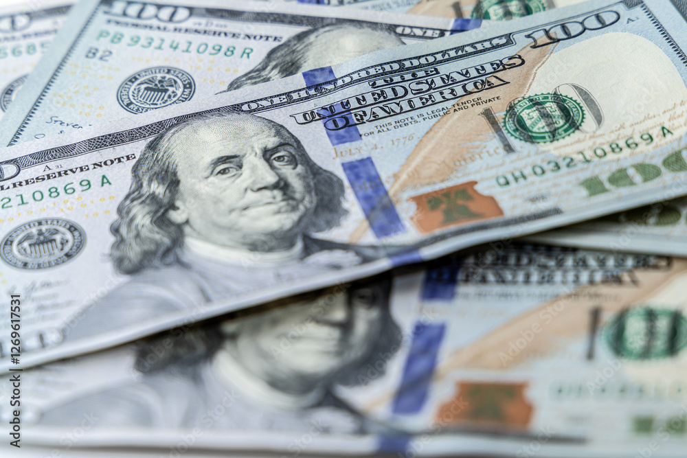 Hundred dollar bills are scattered on the table. Finance of the United States of America. Hundred dollar bills are scattered on the table. Finance of the United States of America.