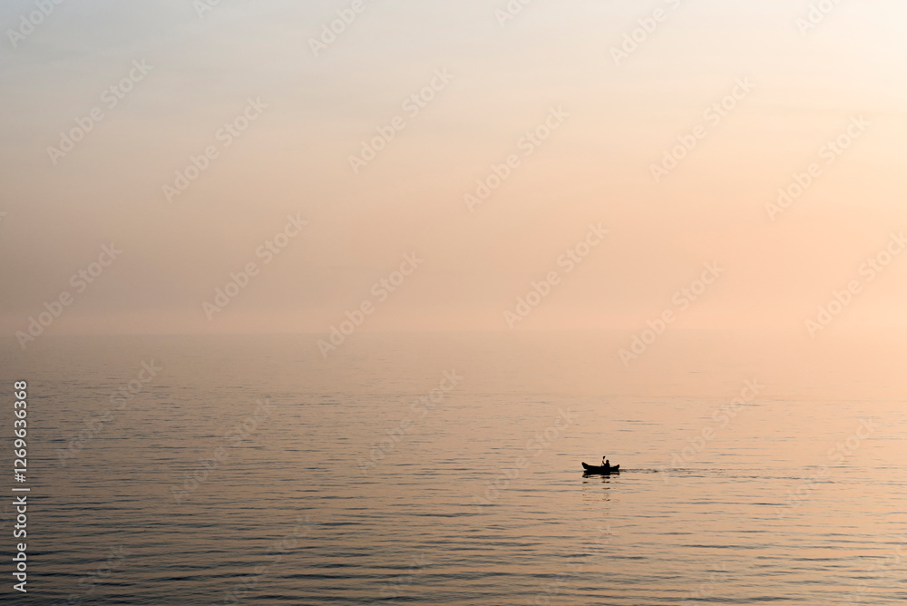 Fototapeta premium Silhouette of a person canoeing