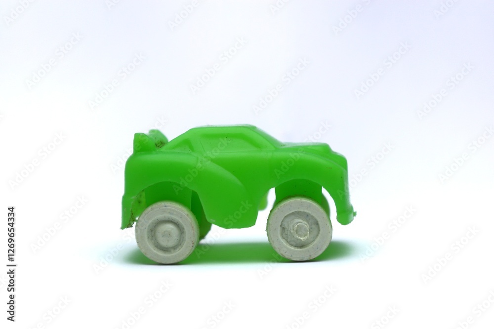 Isolated Green Toy Car with White Background, Macro Shot Children's Toy Isolated Green Toy Car with White Background, Macro Shot Children's Toy
