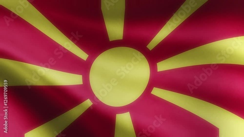 Macedonia Flag 4K, The national flag of Macedonia is proudly displayed on a flagpole, fluttering gracefully in the wind. The official Macedonian flag waves with vibrant motion, symbolizing.