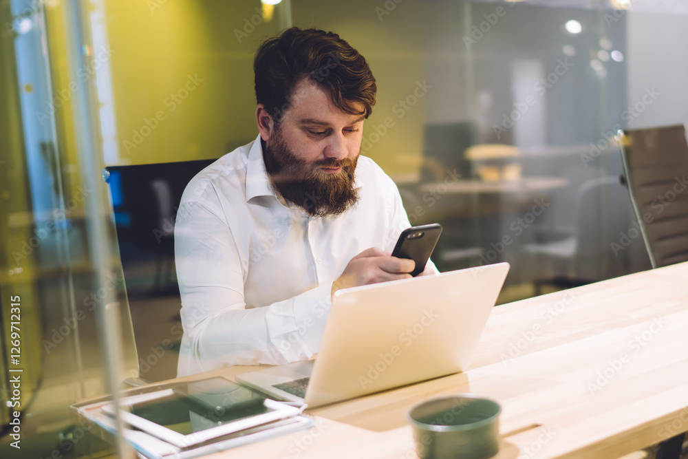 custom made wallpaper toronto digitalHandsome executive browsing mobile and using laptop in workplace
