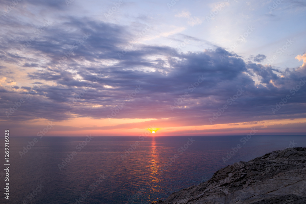 Obraz premium The cliffs of Stintino at sunset in Europe, Italy, Sardinia, Stintino, in summer, on a sunny day.