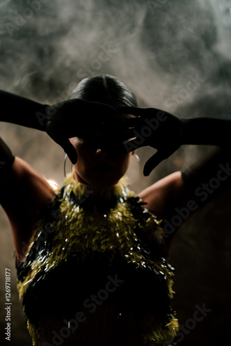 Tableau sur toile Dancing silhouette of a Latina woman in smoke performing bachata and rumba at ni