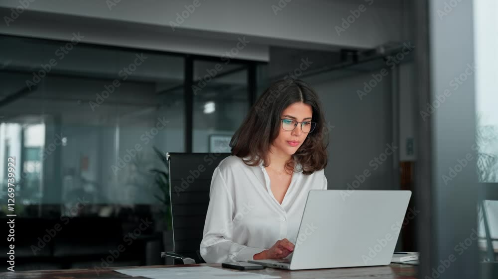 30s middle eastern indian woman using computer technology app for work online. Young professional it specialist latin hispanic business lady working on laptop pc sitting at desk in modern office space