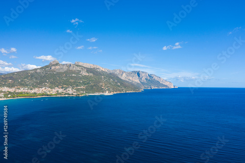 The cliffs by the sea in Lotzorai in Europe, Italy, Sardinia, Lotzorai, in summer, on a sunny day.