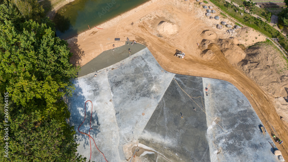 Aerial View of landscaping Construction Site with Workers Pouring Concrete Aerial View of landscaping Construction Site with Workers Pouring Concrete