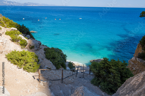 Fototapeta Naklejka Na Ścianę i Meble -  Access to Cala Goloritze beach in Baunei in Europe, Italy, Sardinia, Baunei, in summer, on a sunny day.
