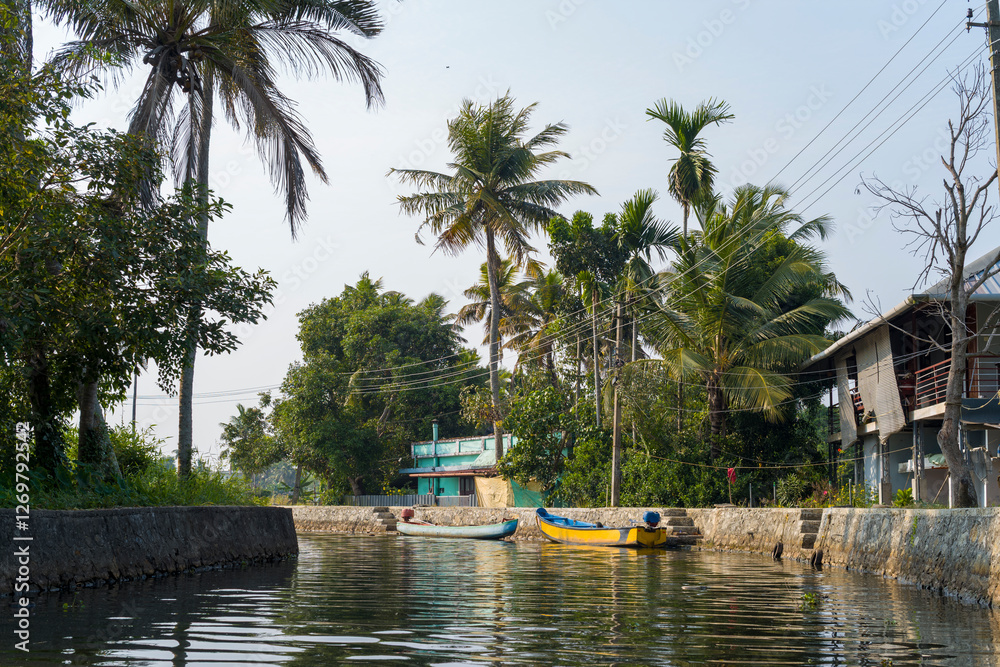 The backwaters at Alappuzha in Asia, India, Kerala, Alleppey, in summer, on a sunny day. The backwaters at Alappuzha in Asia, India, Kerala, Alleppey, in summer, on a sunny day.