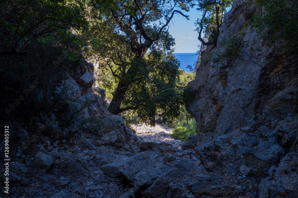 The Su Porteddu hiking trail in Baunei in Europe, Italy, Sardinia, Baunei, in summer, on a sunny day. The Su Porteddu hiking trail in Baunei in Europe, Italy, Sardinia, Baunei, in summer, on a sunny day.
