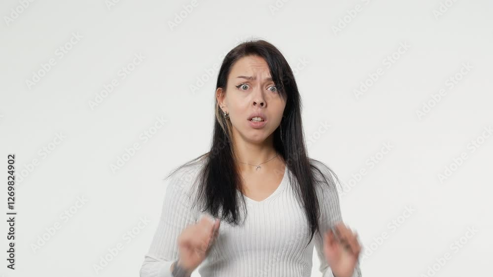 stupefied brunette woman keeps mouth opened feels shocked concentrated away at something horrible wears isolated over whitr background blank copy space for advert stupefied brunette woman keeps mouth opened feels shocked concentrated away at something horrible wears isolated over whitr background blank copy space for advert