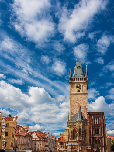 Photography Old Town Hall in Prague with medieval clock tower and beautiful white clouds