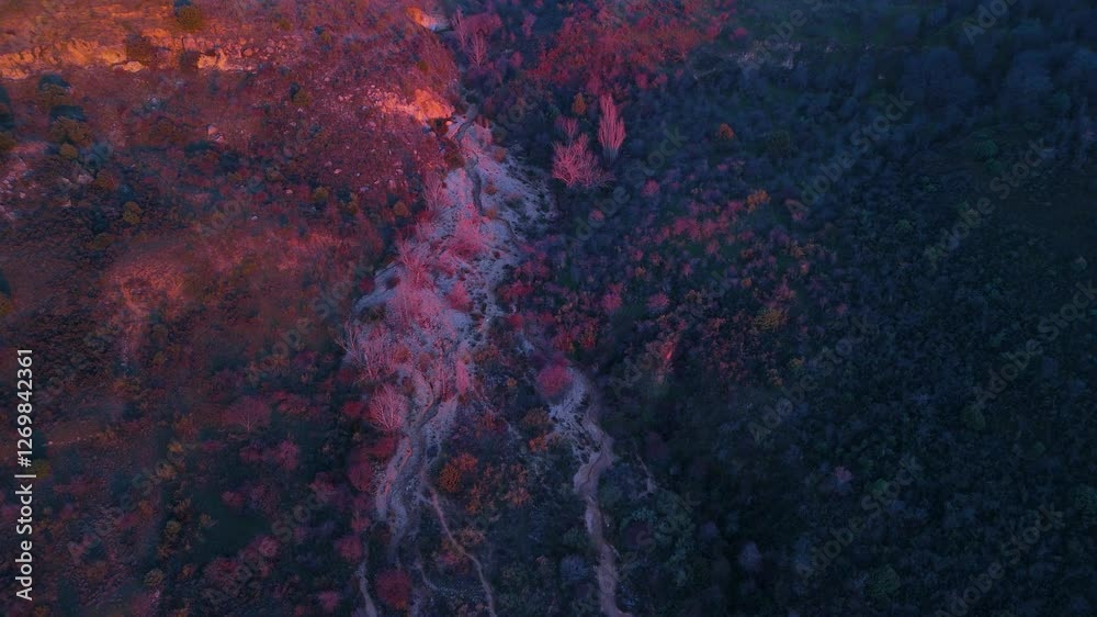 Sunset from a drone of the arid landscape of ravines and erosions in the surroundings of Las Cárcavas. Valdepeñas de la Sierra. Guadalajara. Castilla La Mancha. Spain. Europe
