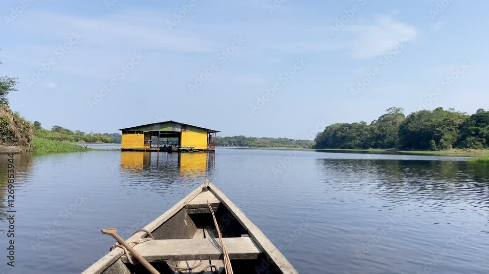 Wooden canoe heading towards entrance of jungle lake Tarapoto, Amazon, Colombia. Wooden canoe heading towards entrance of jungle lake Tarapoto, Amazon, Colombia.