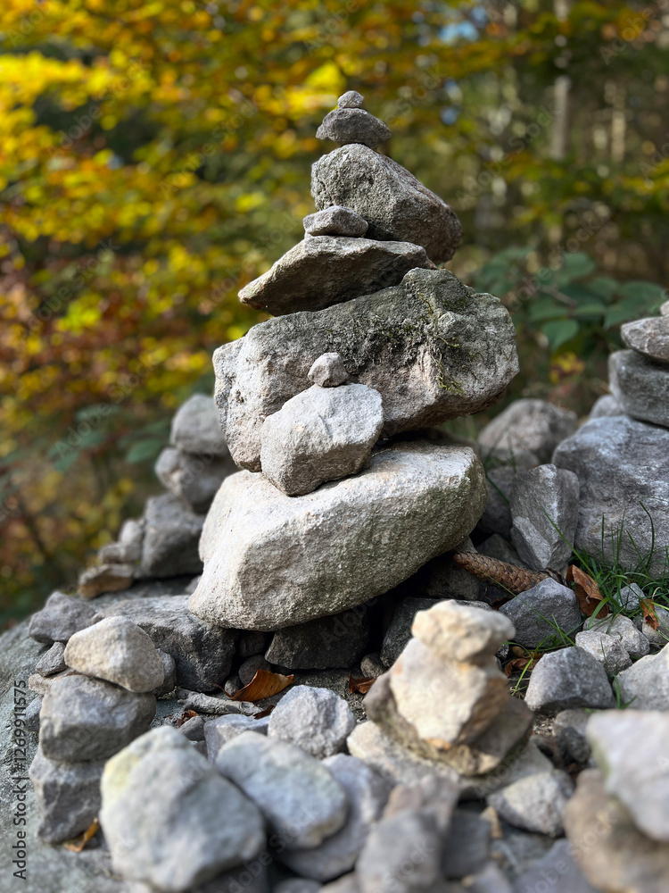 A carefully stacked stone cairn in a peaceful forest setting, symbolizing balance, mindfulness, and meditation. A perfect nature-inspired image for wellness, travel, and outdoor adventure themes A carefully stacked stone cairn in a peaceful forest setting, symbolizing balance, mindfulness, and meditation. A perfect nature-inspired image for wellness, travel, and outdoor adventure themes