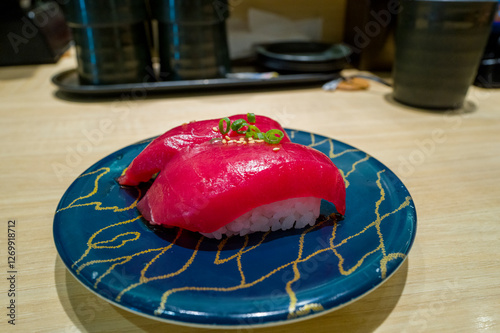 Tuna sushi in Osaka in Asia, Japan, Kansai, Osaka, in summer, on a sunny day. photo