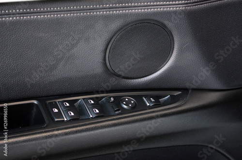 Driver door trim. Window lifters control. Car Inside Door Handle Interior. Driver Side Master Window Switch. Speaker in car door. Leather car interior.