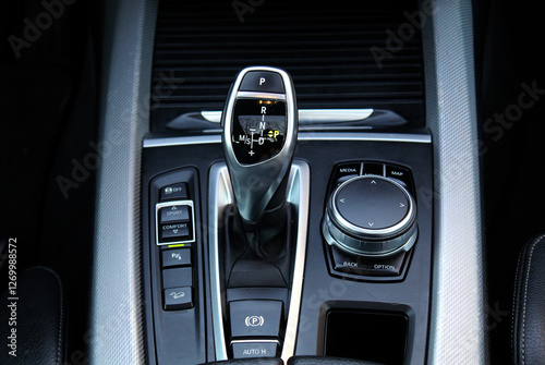 Automatic transmission gearshift stick, Closeup a manual shift of modern car gear shifter. Close up of the automatic gearbox lever, black interior car. photo