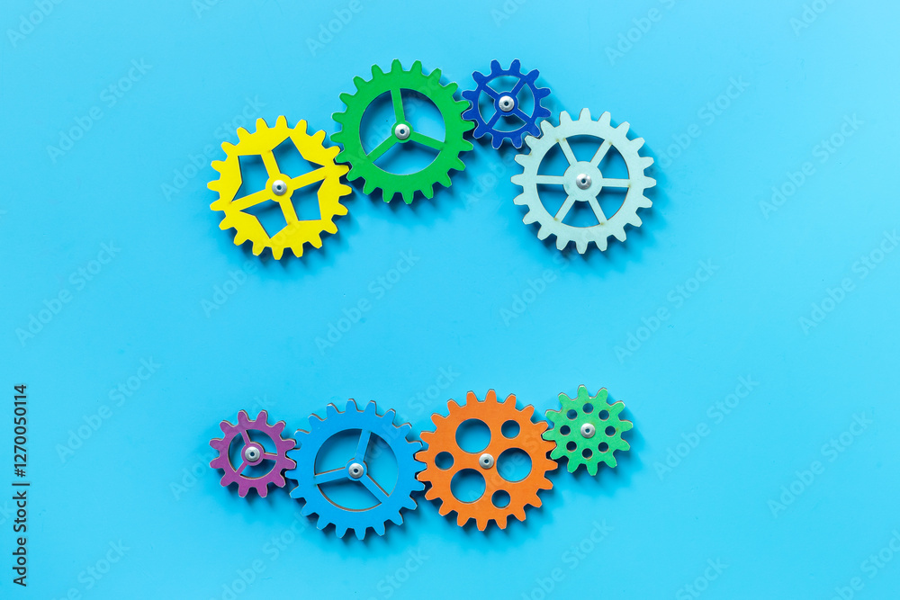 Colorful gears are connected together as a symbol of teamwork and business automation Colorful gears are connected together as a symbol of teamwork and business automation