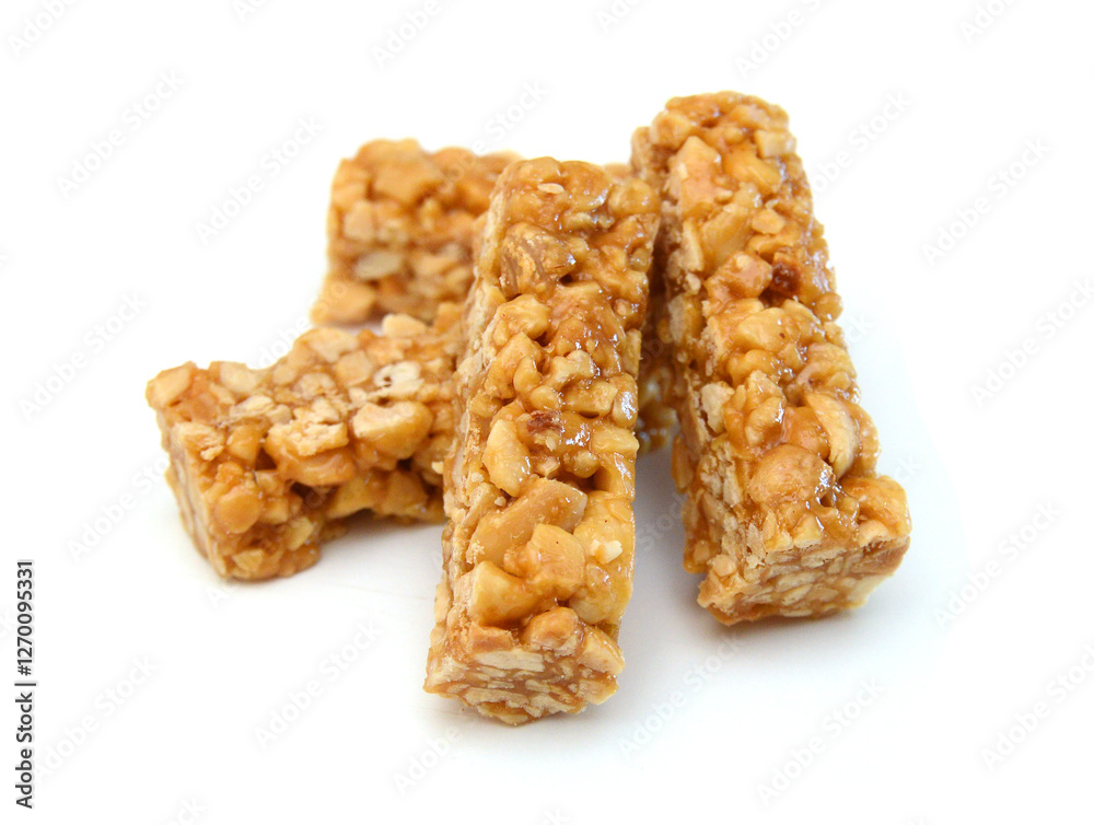 Honey bars with peanuts, sesame and sunflower seeds isolated Honey bars with peanuts, sesame and sunflower seeds isolated