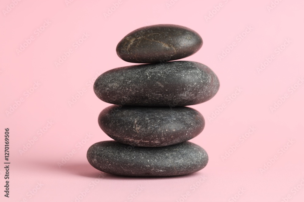 Stack of rocks on pink background. Harmony and life balance Stack of rocks on pink background. Harmony and life balance