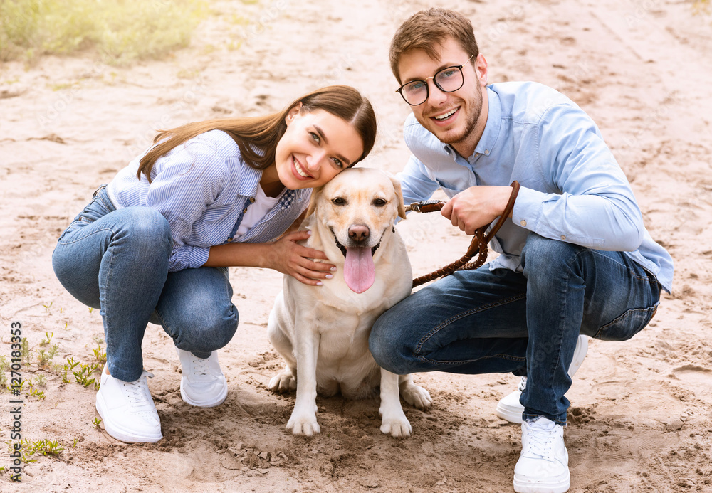 Dog-Friendly Date Concept. Two young people sitting with dog, looking at camera, holding pet on a leash Dog-Friendly Date Concept. Two young people sitting with dog, looking at camera, holding pet on a leash
