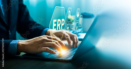 Bild auf Leinwand Businessman Using ERP Software on Laptop, Highlighting Enterprise Resource Plann