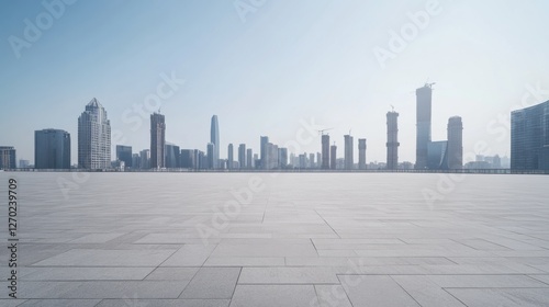 A deserted wide plaza with a distant city skyline. Featuring calm and openness