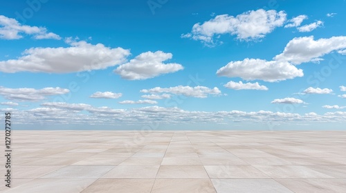 Empty paved area under a blue sky with clouds. Ideal for product placement