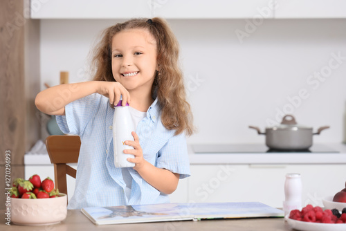 Happy little girl with bott...