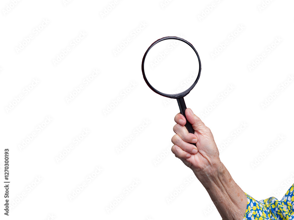 Senior hand holding magnifying glass – search, focus, and inspection concept. Senior hand holding magnifying glass – search, focus, and inspection concept.