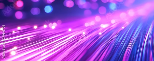 A vibrant, abstract image featuring flowing lines of light in shades of purple and blue, creating a dynamic and energetic visual effect.