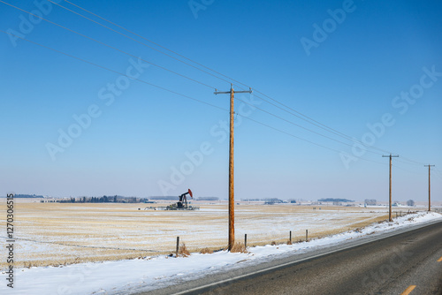Power lines and oil derrick
