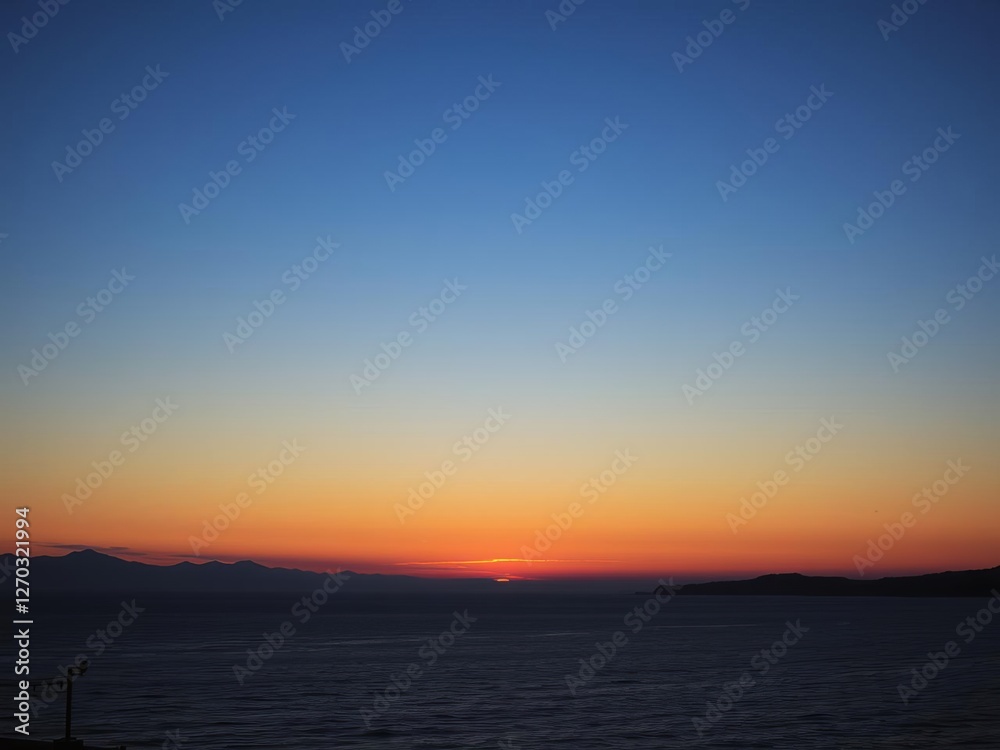 Sun setting over a tranquil lake with a silhouetted tree framing the scene, view, scenic, horizon Sun setting over a tranquil lake with a silhouetted tree framing the scene, view, scenic, horizon