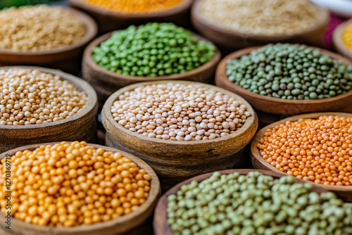 A display of legumes such as lentils and chickpeas, rich in plant-based protein and iron in wooden bowls