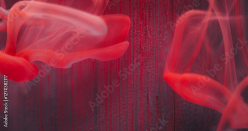 Blur liquid emulsion. Paint water texture. Defocused red color shine drops flow fluid smoke wave on abstract art light background.