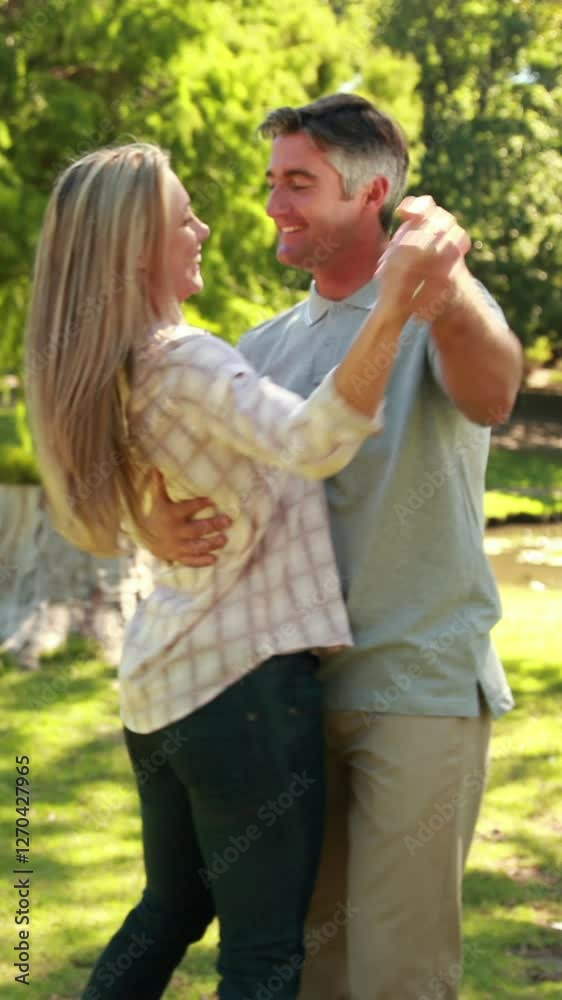 Happy couple dancing in the park Happy couple dancing in the park