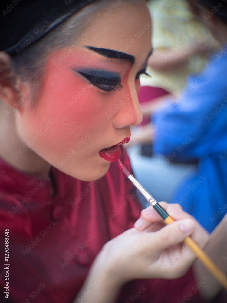 Beautiful young woman with Chinese Opera dress in Chiang Mai, Thailand.