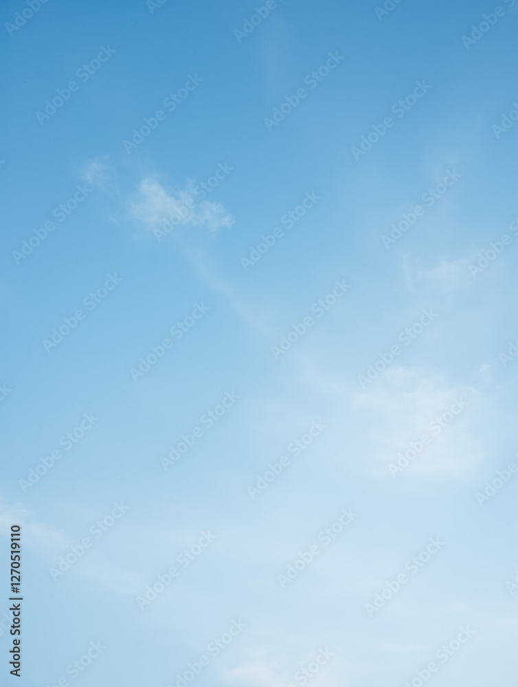 Clear blue sky with light cloud patterns in daylight Clear blue sky with light cloud patterns in daylight