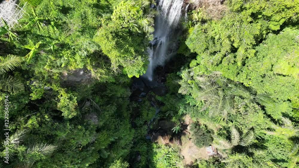 Munduk Waterfall in Buleleng, Bali, is a stunning cascade surrounded by lush greenery. Its cool mist, soothing sounds, and serene atmosphere create a truly magical escape. Munduk Waterfall in Buleleng, Bali, is a stunning cascade surrounded by lush greenery. Its cool mist, soothing sounds, and serene atmosphere create a truly magical escape.