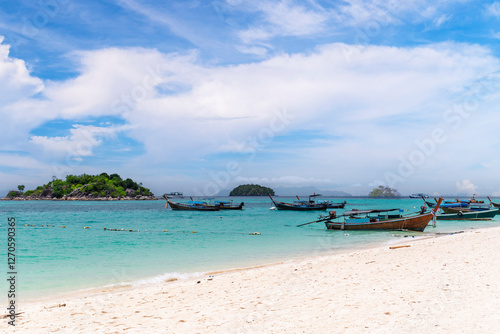 Obraz na płótnie Beautiful Andaman sea, Tropical Turquoise clear blue sea and white sand beach on sunset beach with blue sky background at Lipe Island, Satun, Thailand - summer vacation travel w salonie