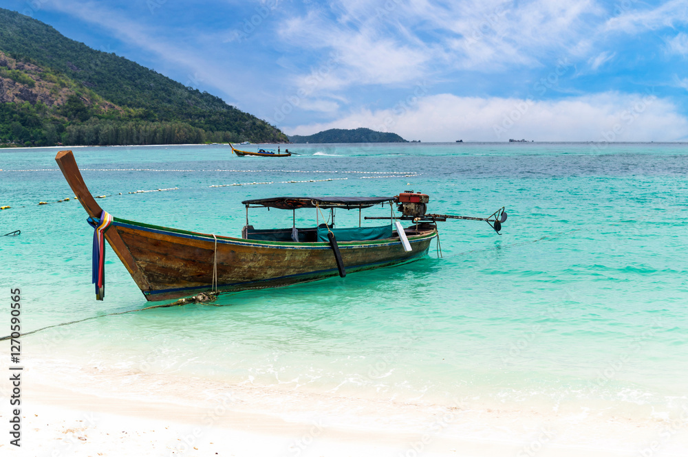 Beautiful Andaman sea, Tropical Turquoise clear blue sea and white sand beach on sunset beach with blue sky background at Lipe Island, Satun, Thailand - summer vacation travel