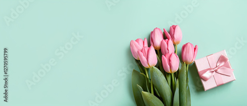 Bouquet of pink tulips and gift box,Spring flowers. Flat lay. Copy space. Banner