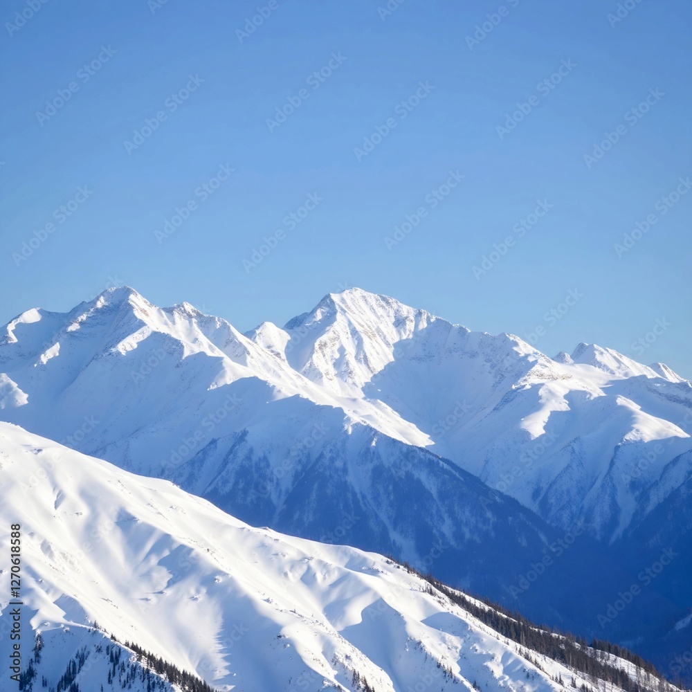 Obraz premium Snow-covered mountains with a clear blue sky